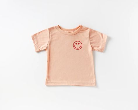 Saved by Grace | Heart Eye Smile Pocket Style Tee in Peach